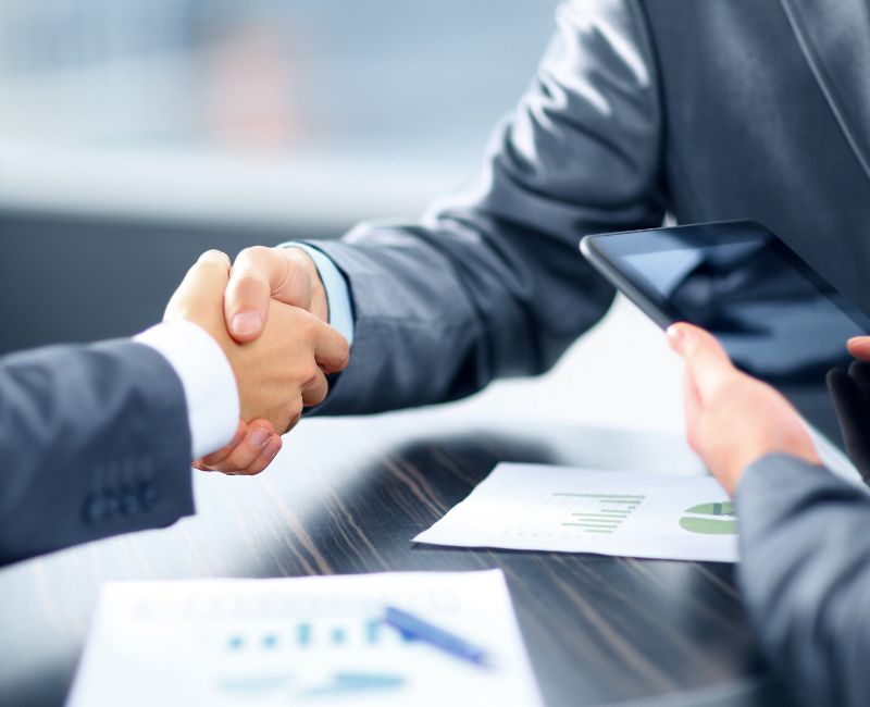 Client handshake with financial representative Client handshake with financial representative